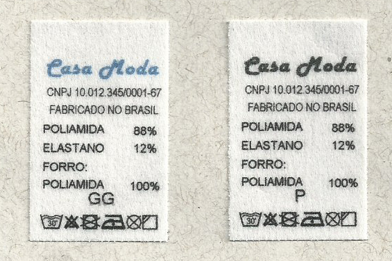 Foto de etiqueta com dados da empresa e dados de composição do tecido